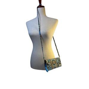 Vera Bradley‎ wallet with shoulder strap.